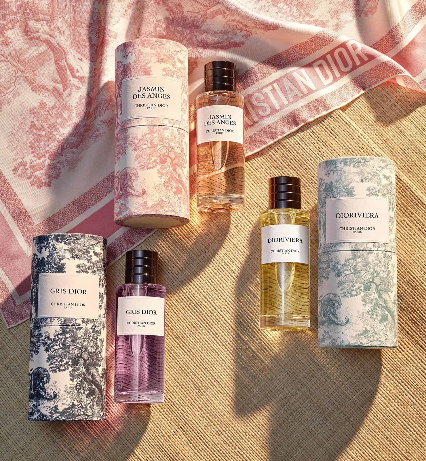 A curated arrangement of Dior fragrance bottles in soft natural light
